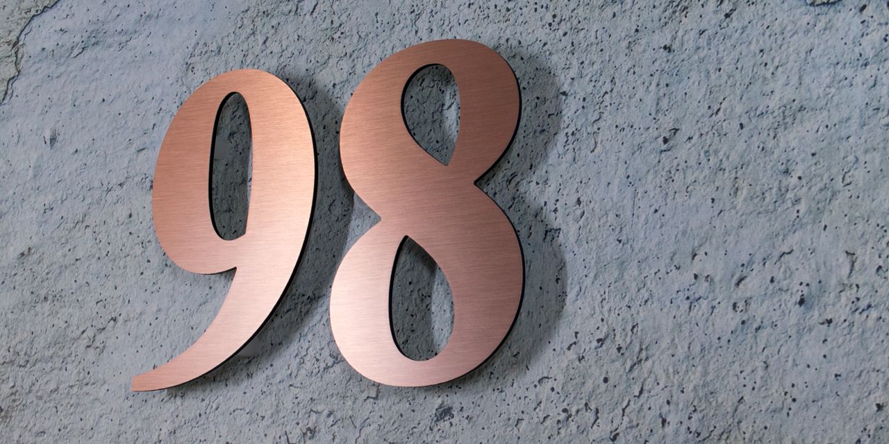 Brushed bronze float off the wall house numbers