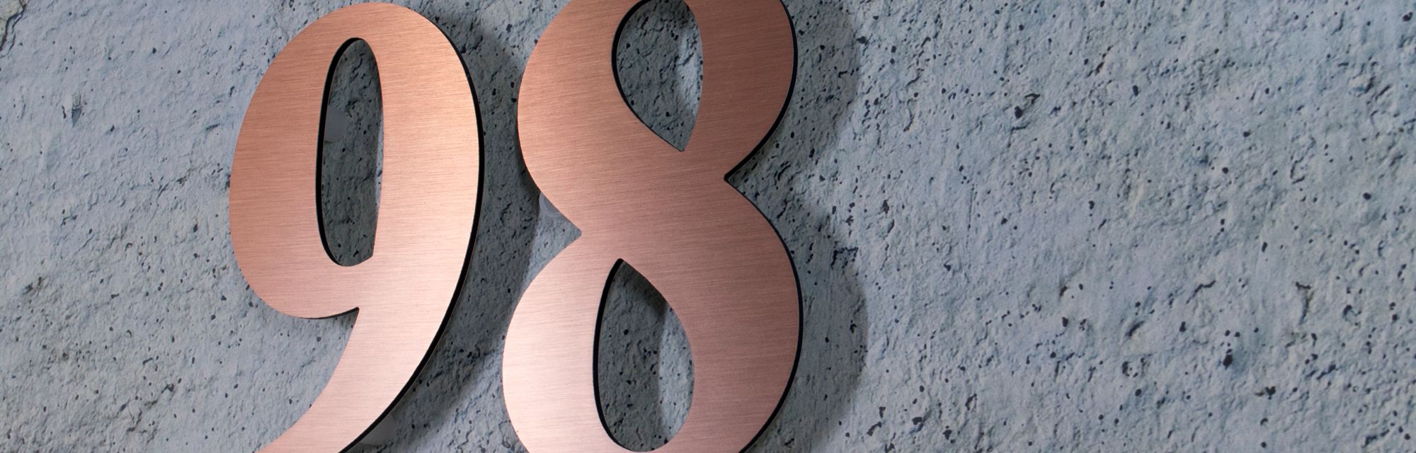 Brushed bronze float off the wall house numbers